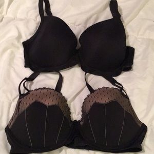 Two black bras slightly padded